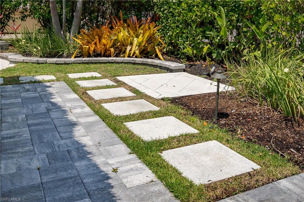 13613 Snapper Lane Naples, FL 34114 - Photo 37 of 49 a view of yard with swimming pool