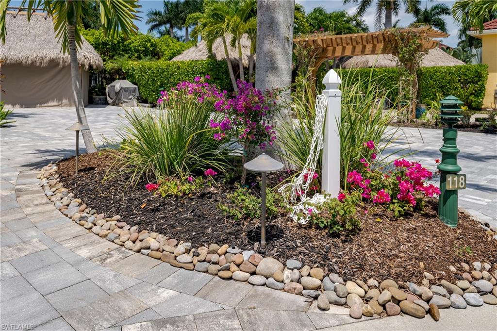 13613 Snapper Lane Naples, FL 34114 - Photo 44 of 49 a view of a potted flower in a yard