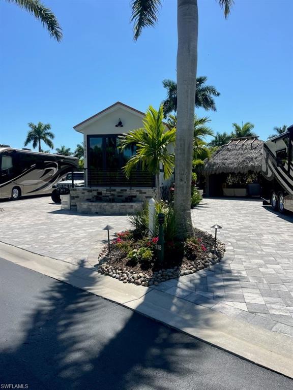 13613 Snapper Lane Naples, FL 34114 - Photo 45 of 49 a view of house with outdoor space