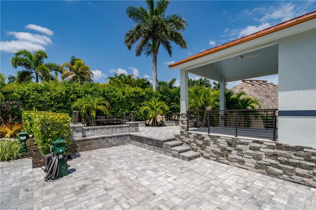 13613 Snapper Lane Naples, FL 34114 - Photo 5 of 49 a view of yellow house with potted plants