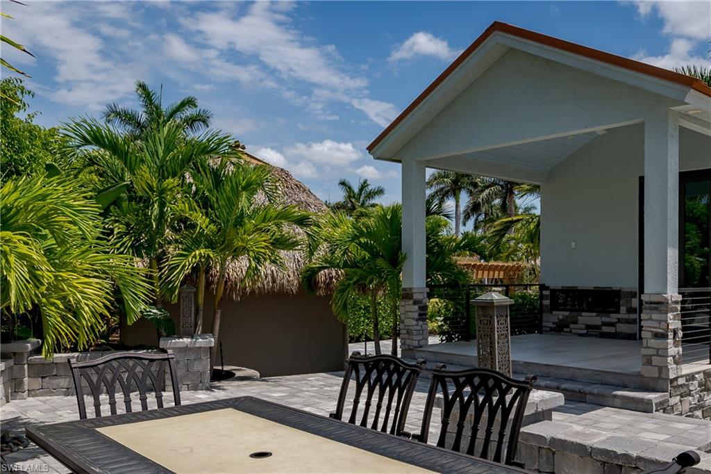 13613 Snapper Lane Naples, FL 34114 - Photo 6 of 49 a view of a house with backyard and sitting area