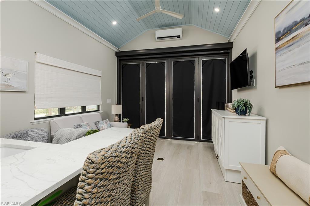 13613 Snapper Lane Naples, FL 34114 - Photo 10 of 49 a bedroom with bed and a chair