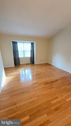 a bathroom with a granite countertop sink a mirror and a toilet