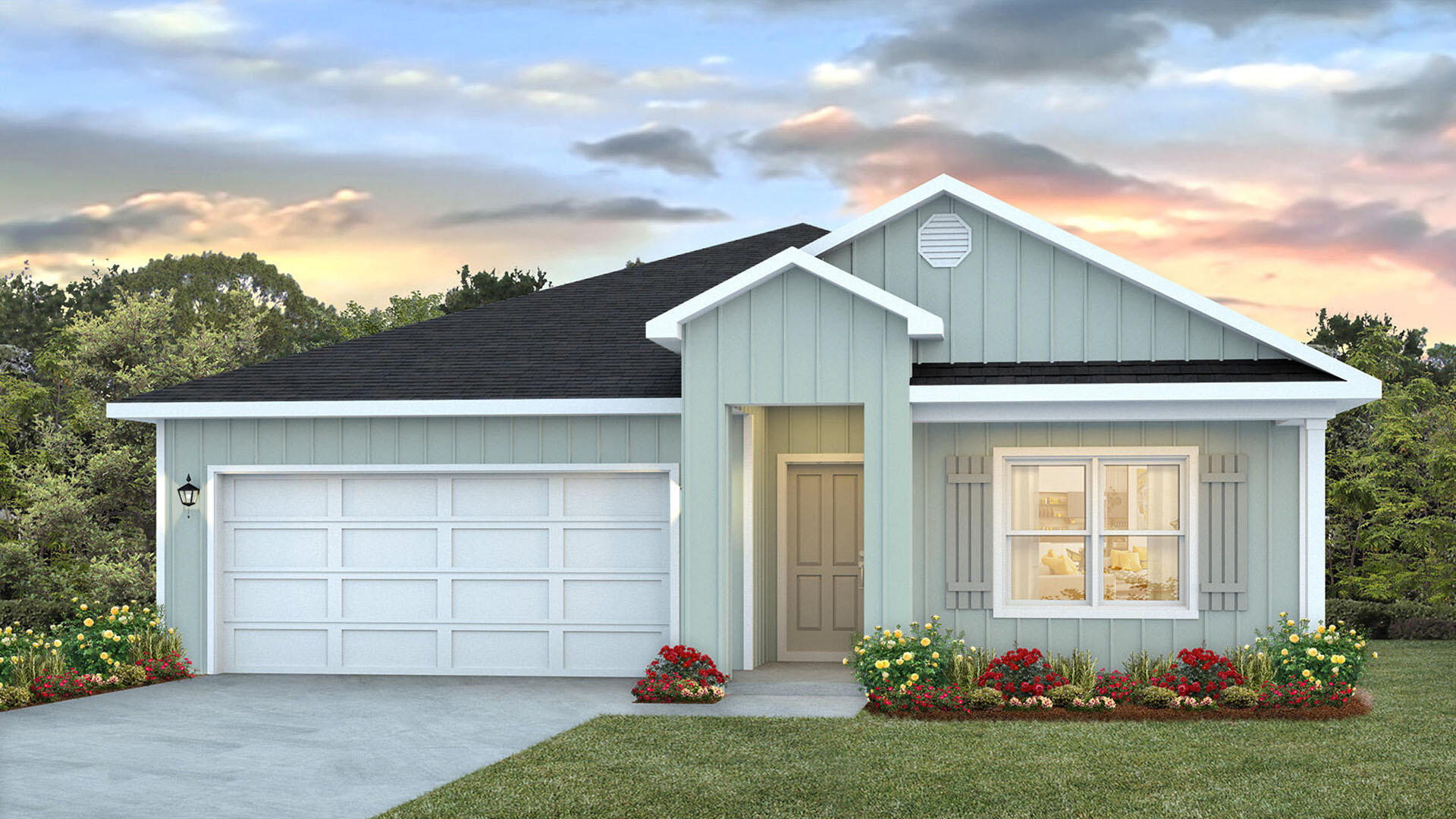 a front view of a house with a garden and yard