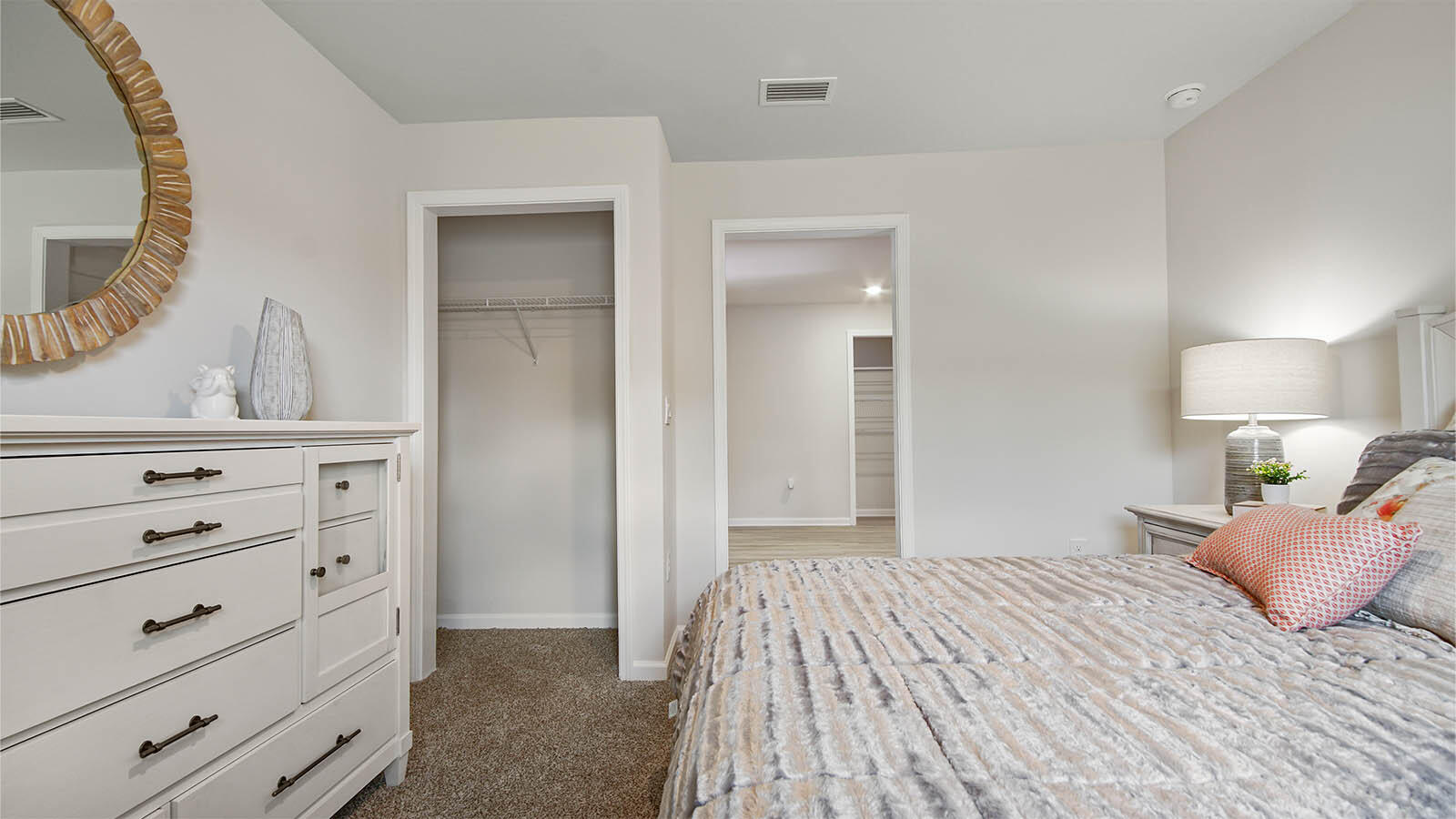 31 Riverwalk Circle Freeport, FL 32439 - Photo 35 of 38 a bedroom with a bed and a mirror