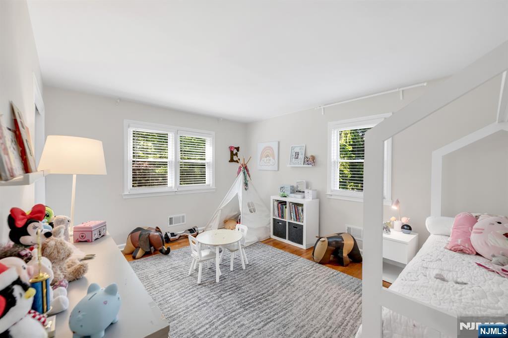 433 Piermont Road Cresskill, NJ 07626 - Photo 24 of 49 a bed room with furniture and a window