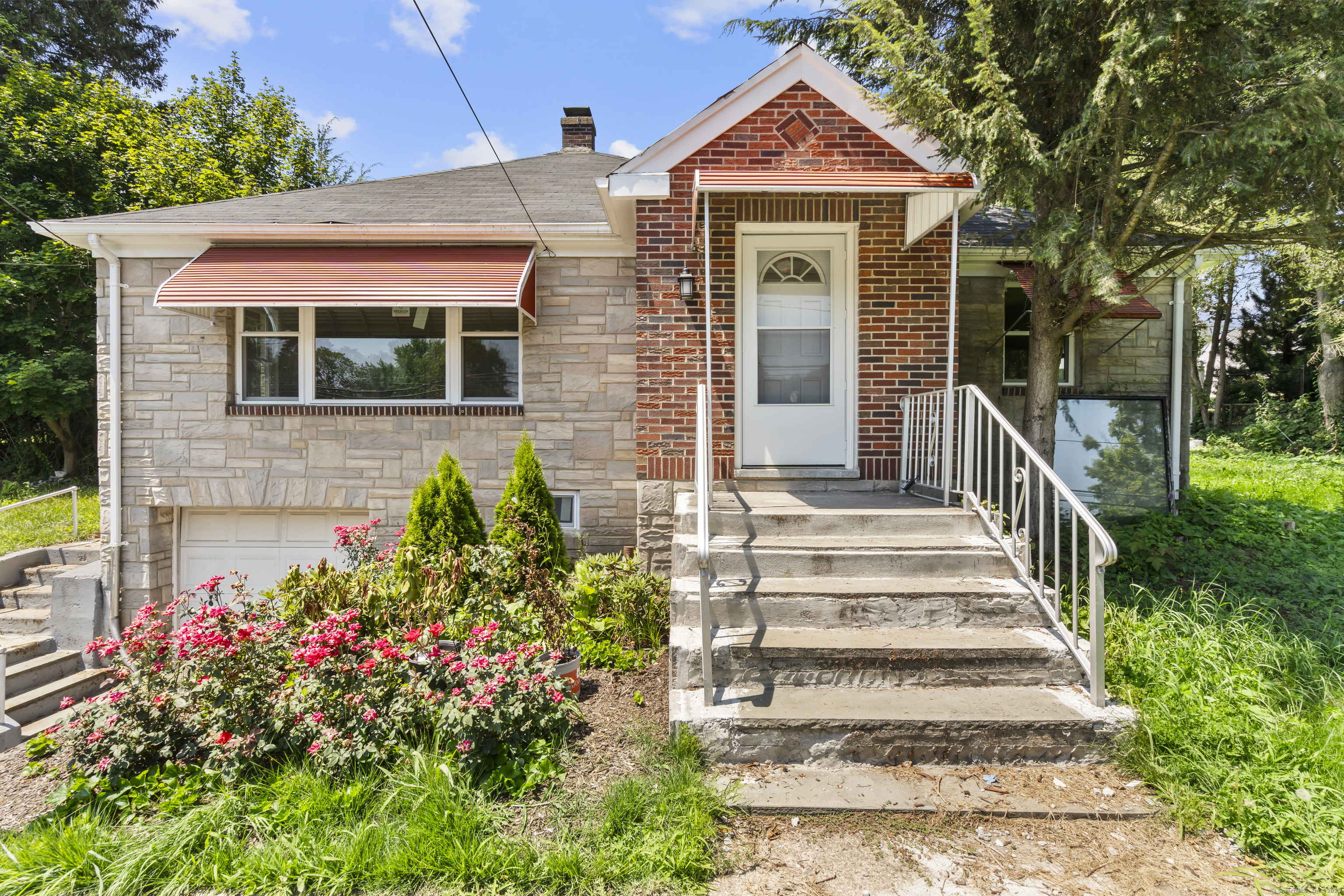 2603 North Main Street Waterbury, CT 06704 - Photo 1 of 1 a front view of a house with a yard