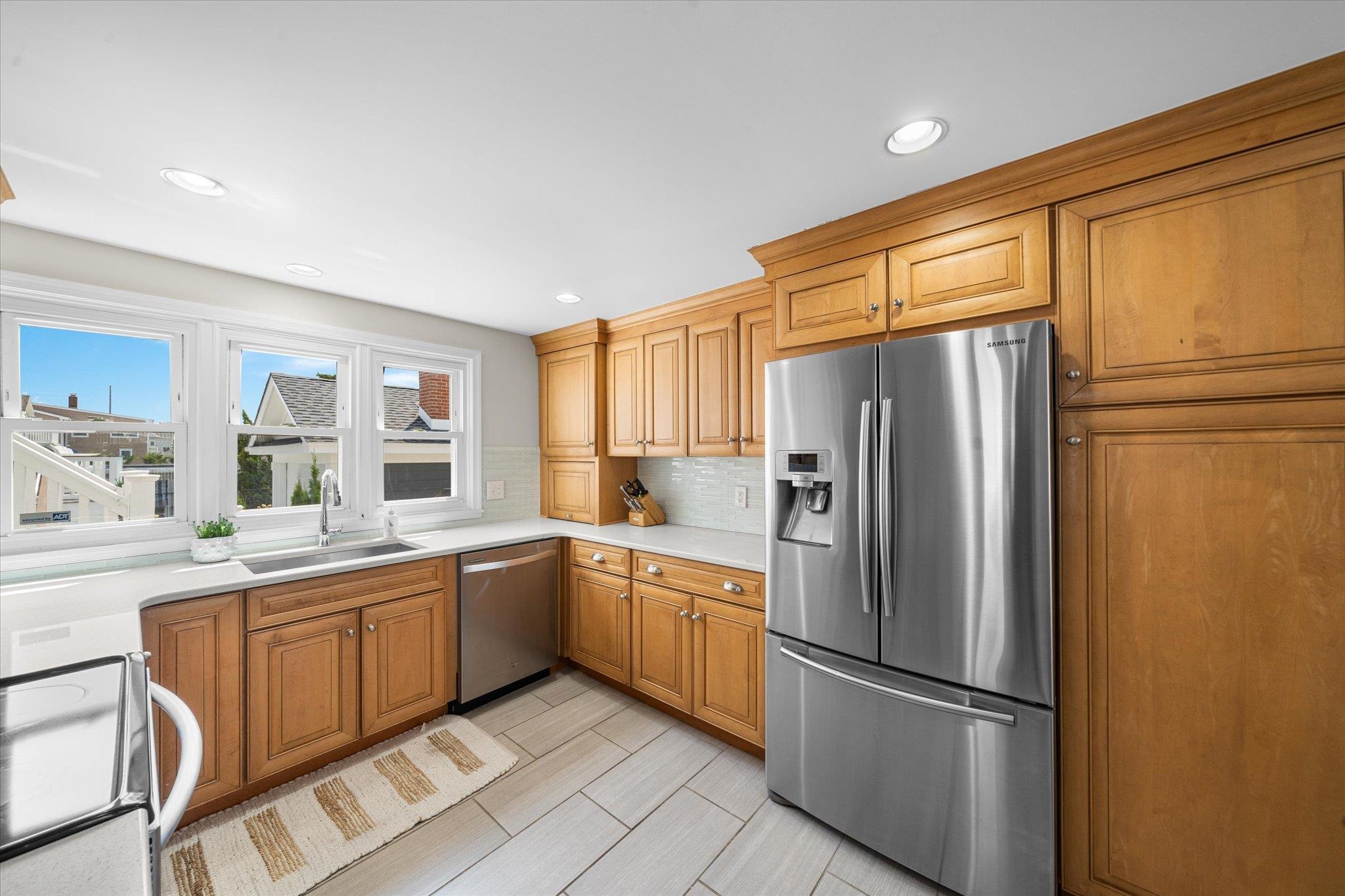 8610 3rd Stone Harbor, NJ 08247 - Photo 18 of 46 a kitchen with stainless steel appliances a refrigerator sink and cabinets