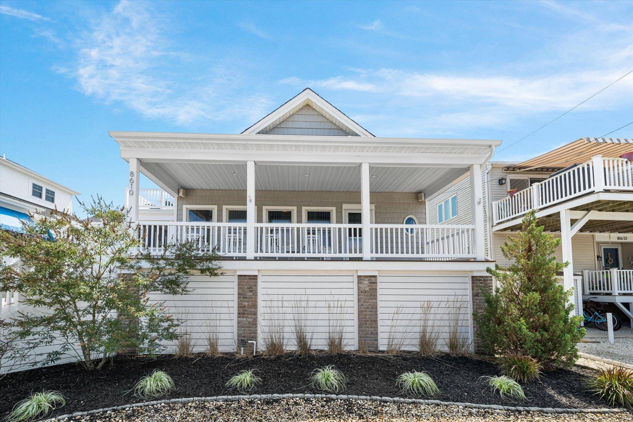 8610 3rd Stone Harbor, NJ 08247 - Photo 3 of 46 a view of a white house next to a yard