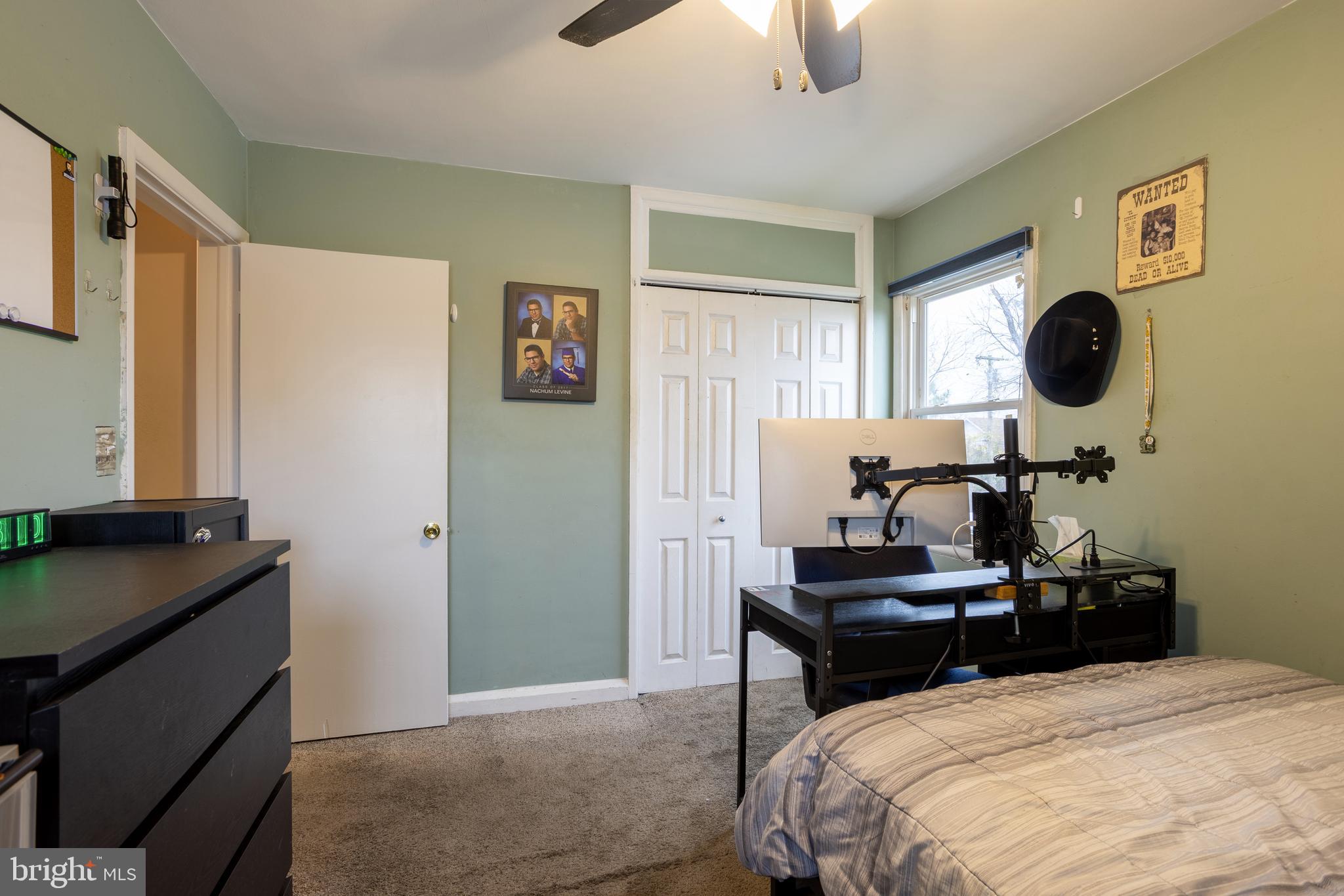 3215 Northbrook Road Baltimore, MD 21208 - Photo 26 of 50 a bedroom with a bed and cabinets