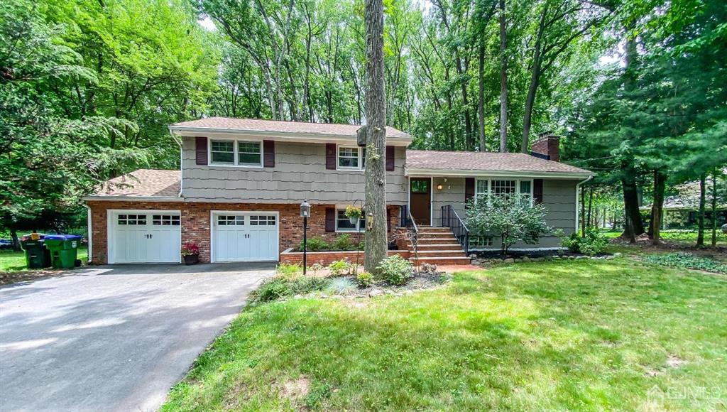 32 Huntington Road Edison, NJ 08820 - Photo 1 of 34 a front view of a house with a garden