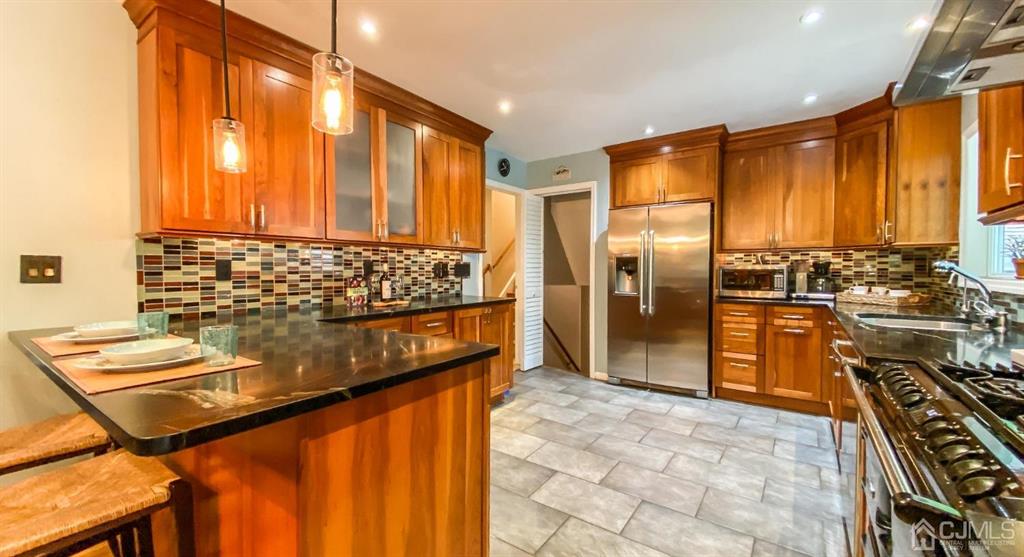 32 Huntington Road Edison, NJ 08820 - Photo 12 of 34 a view of a kitchen with a large window