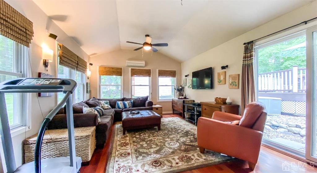 32 Huntington Road Edison, NJ 08820 - Photo 16 of 34 a living room with furniture a large window and a flat screen tv