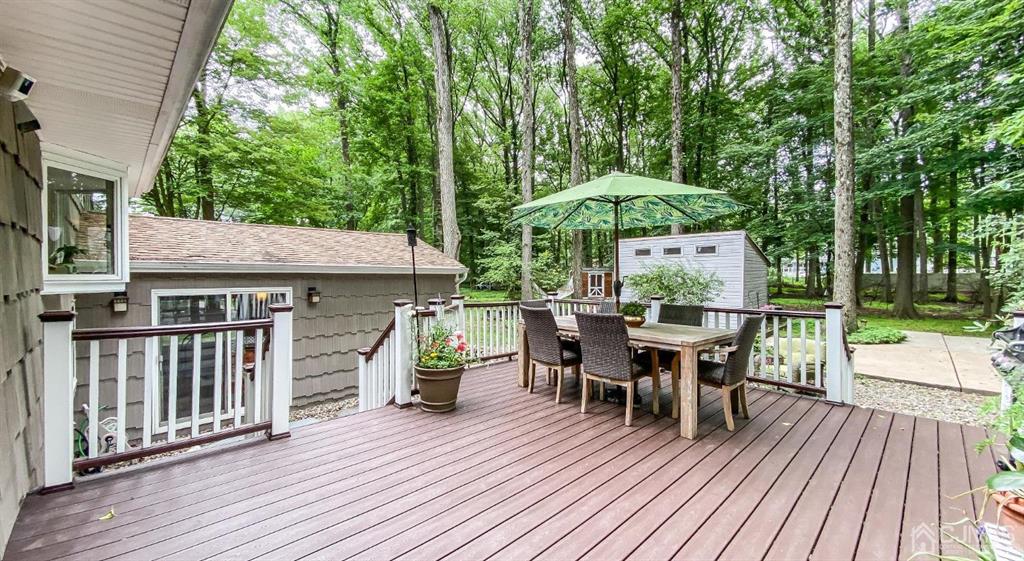 32 Huntington Road Edison, NJ 08820 - Photo 26 of 34 a backyard of a house with wooden floor yard barbeque oven and outdoor seating