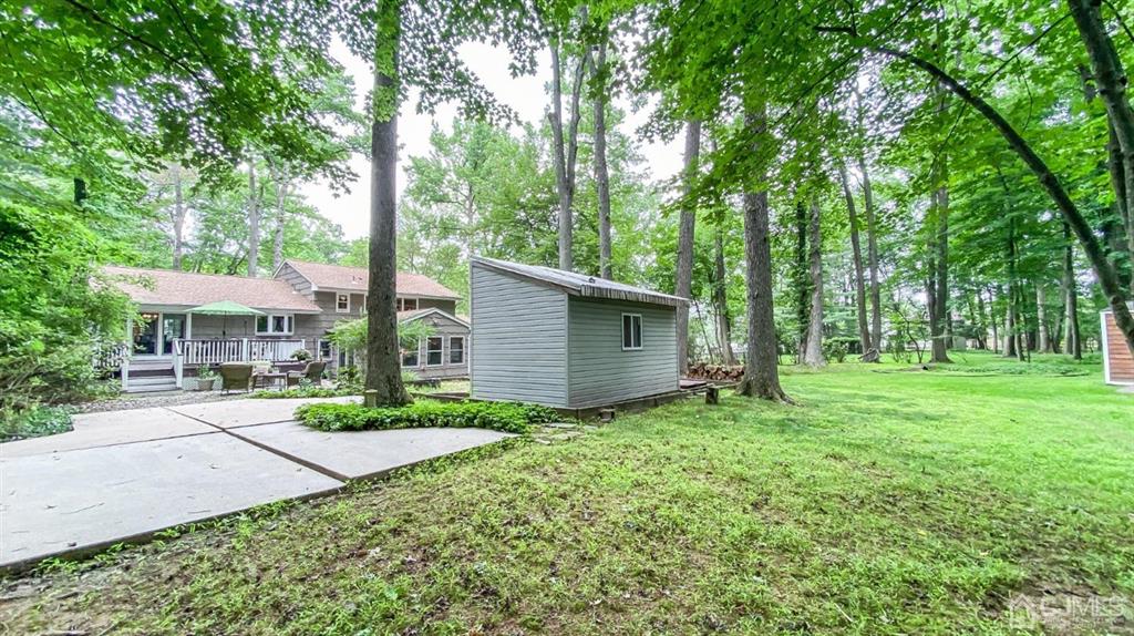 32 Huntington Road Edison, NJ 08820 - Photo 30 of 34 a view of a house with a yard and large trees