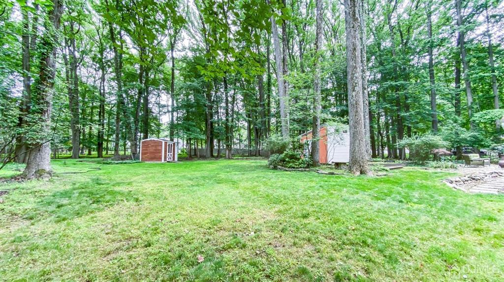 32 Huntington Road Edison, NJ 08820 - Photo 33 of 34 a view of a backyard with a garden and entertaining space