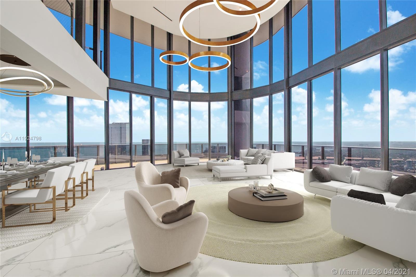 1000 Brickell Plaza, Unit UPH6202 Miami, FL 33131 - Photo 1 of 55 a living room with furniture and a large window