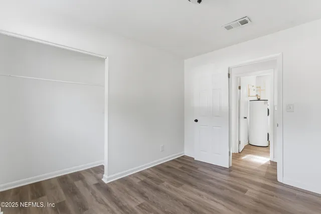 a view of a backyard with a large tree