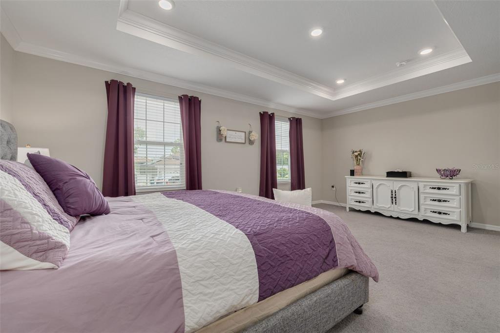 7242 Landmark Drive Spring Hill, FL 34606 - Photo 29 of 45 a spacious bedroom with a bed and a window