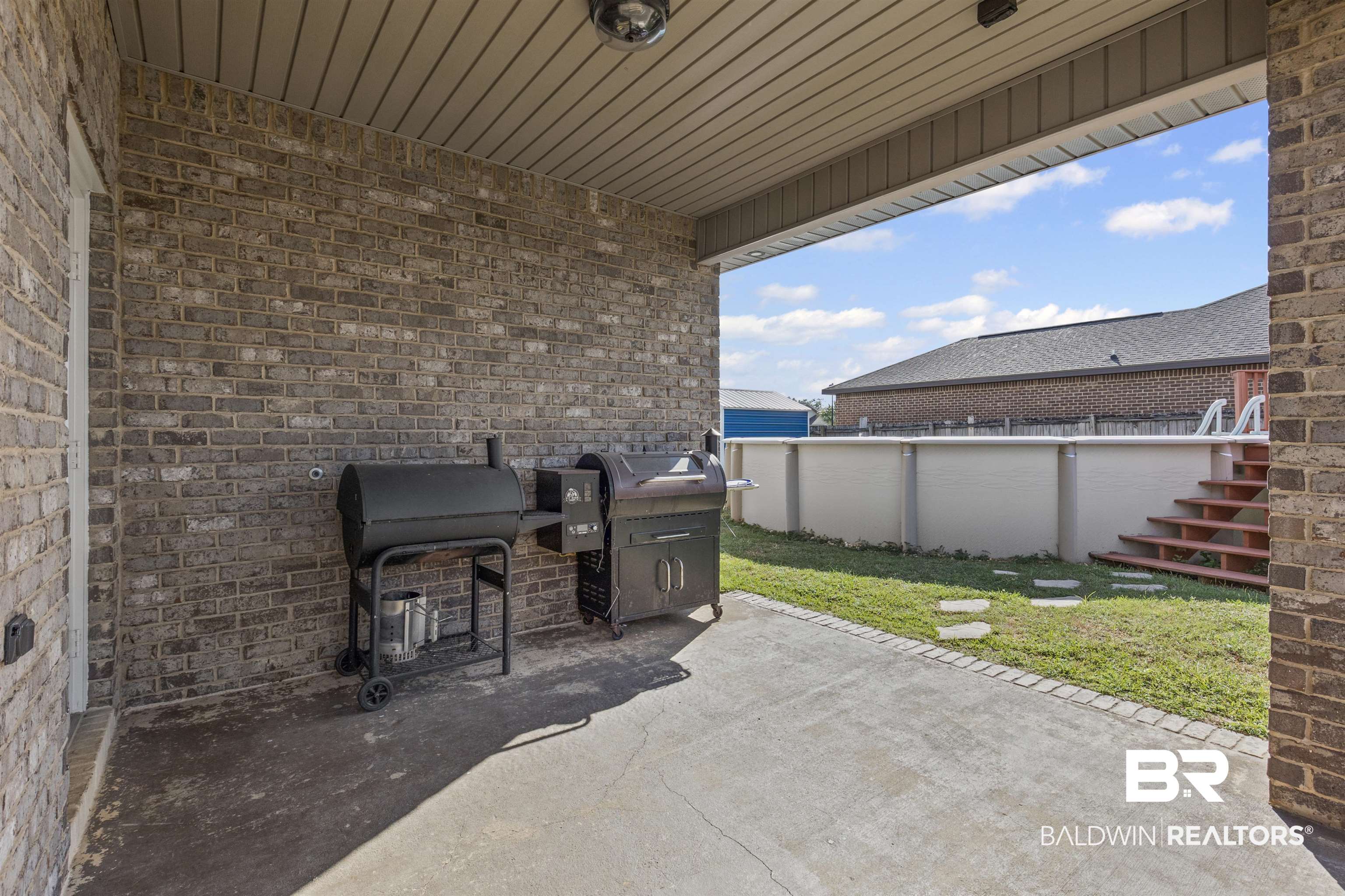 4107 Nottingham Drive Semmes, AL 36575 - Photo 18 of 23 View of patio / terrace with stairway and grilling area