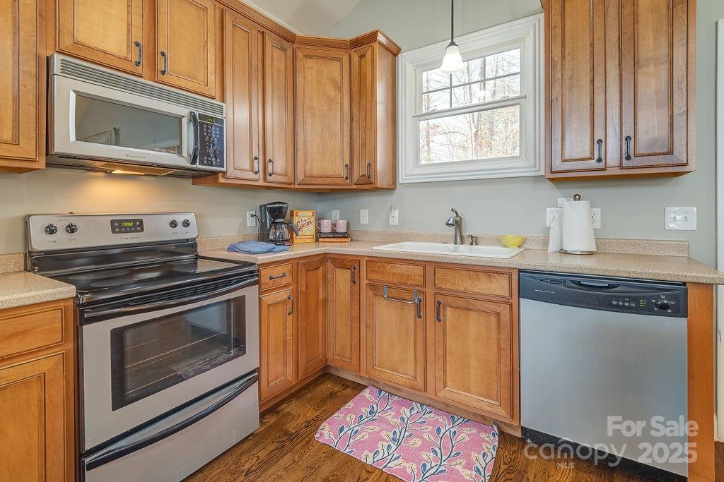 61 Buckle Ridge Weaverville, NC 28787 - Photo 14 of 42 a kitchen with stainless steel appliances granite countertop a sink stove and microwave