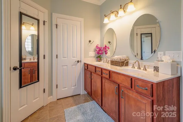 a bathroom with a sink vanity and a mirror