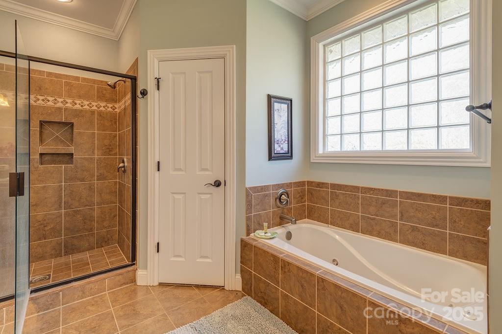 61 Buckle Ridge Weaverville, NC 28787 - Photo 20 of 42 a bathroom with a tub shower and sink
