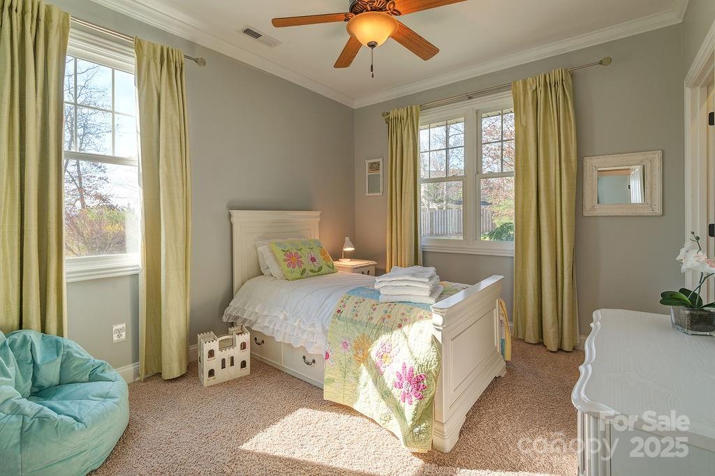 61 Buckle Ridge Weaverville, NC 28787 - Photo 23 of 42 a bedroom with a bed couch and window