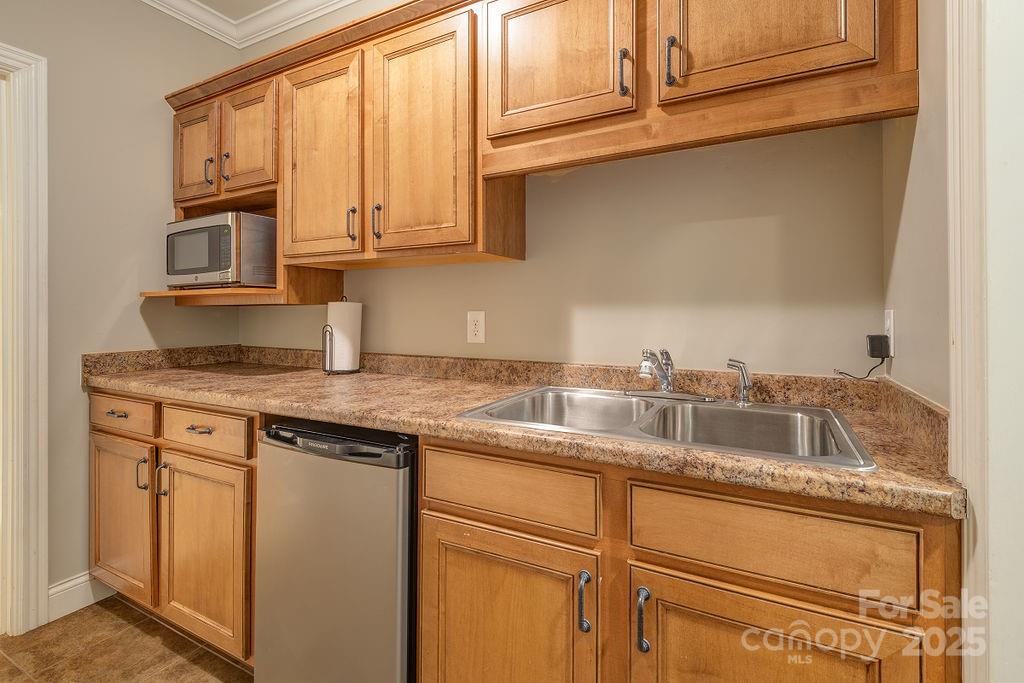 61 Buckle Ridge Weaverville, NC 28787 - Photo 29 of 42 a kitchen with granite countertop stainless steel appliances a sink and cabinets