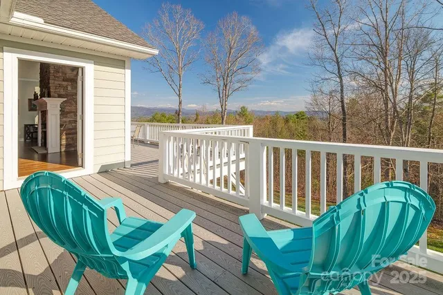 a view of a two chairs in the deck