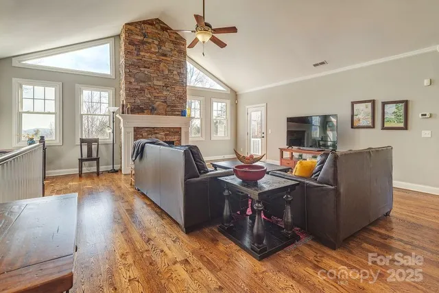 a view of a livingroom with workspace and a couch