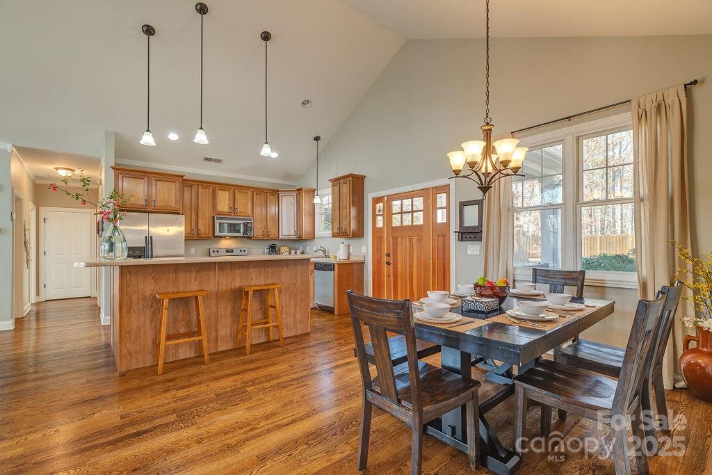 61 Buckle Ridge Weaverville, NC 28787 - Photo 9 of 42 a view of a dining room and livingroom with furniture wooden floor a chandelier