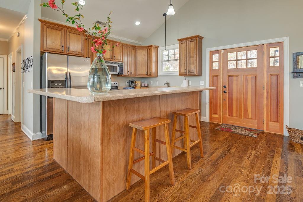 61 Buckle Ridge Weaverville, NC 28787 - Photo 10 of 42 a kitchen with stainless steel appliances kitchen island granite countertop wooden cabinets and a granite counter tops
