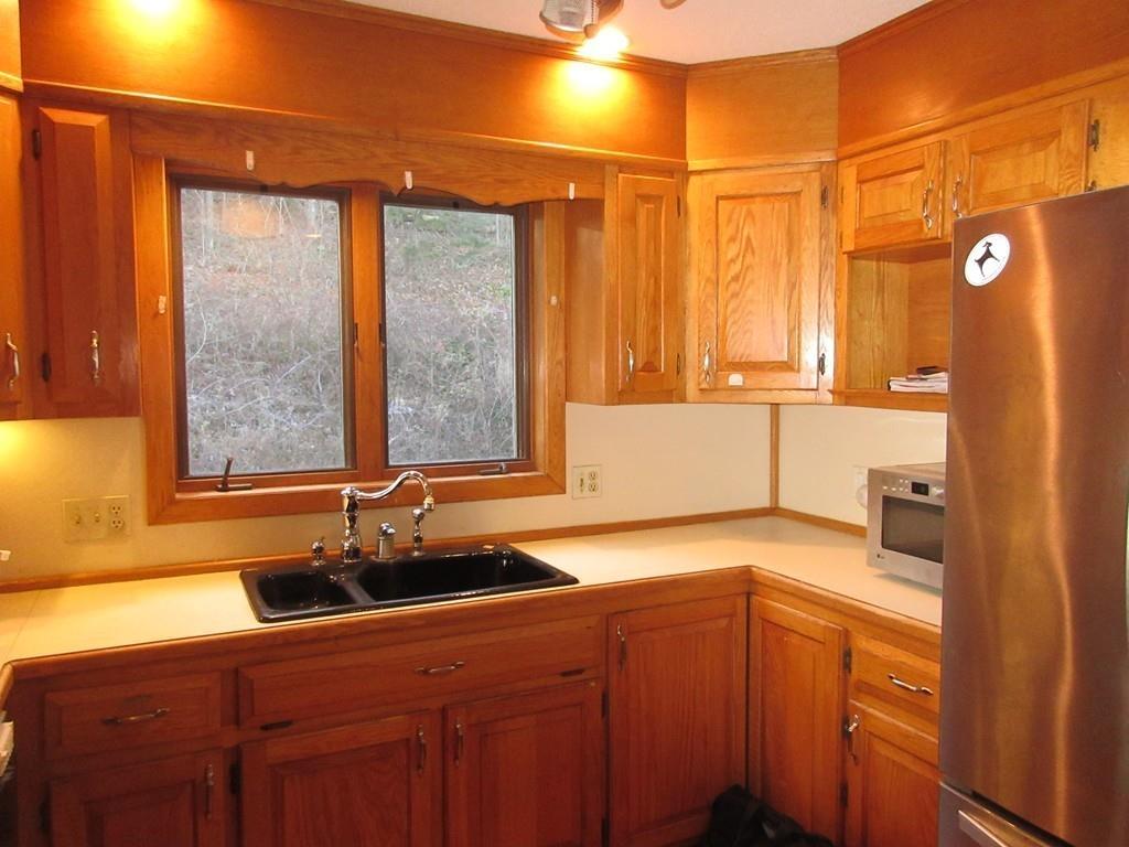 21 Linseed Road Northampton, MA 01060 - Photo 2 of 12 a kitchen with a sink and a window