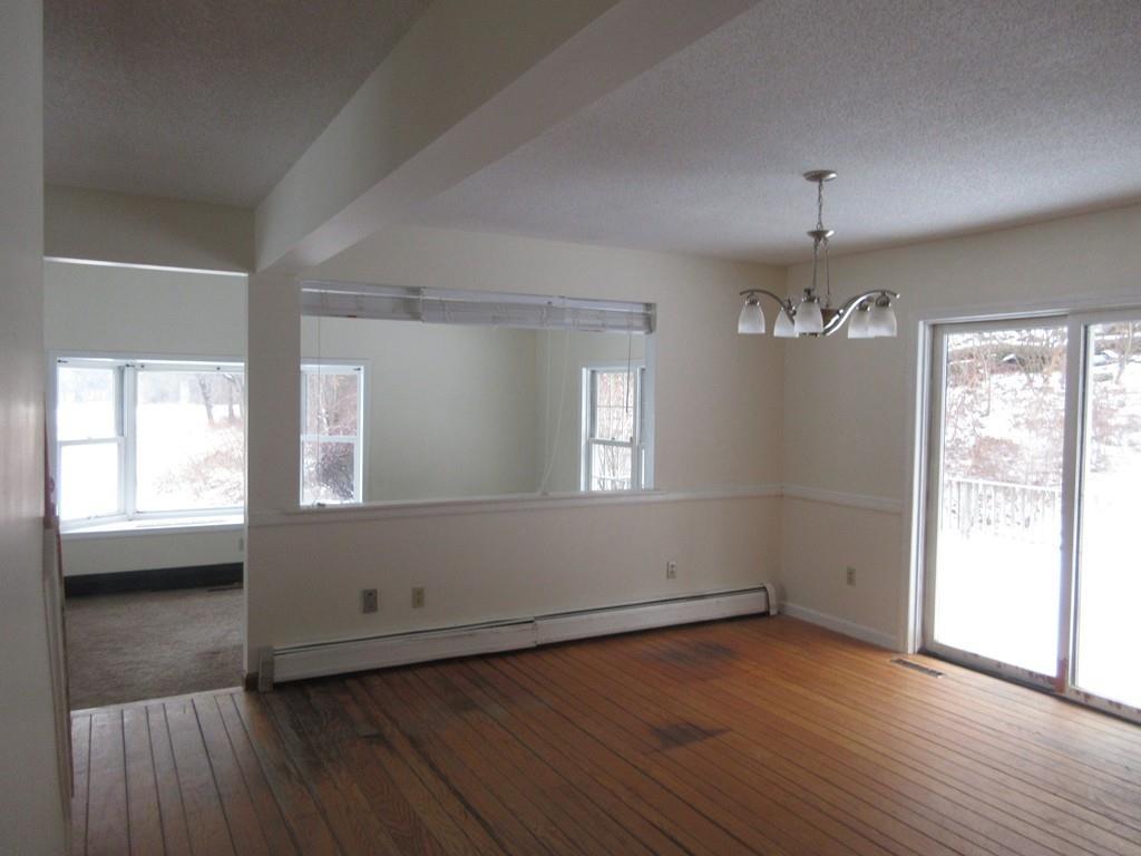 21 Linseed Road Northampton, MA 01060 - Photo 5 of 12 an empty room with wooden floor and windows