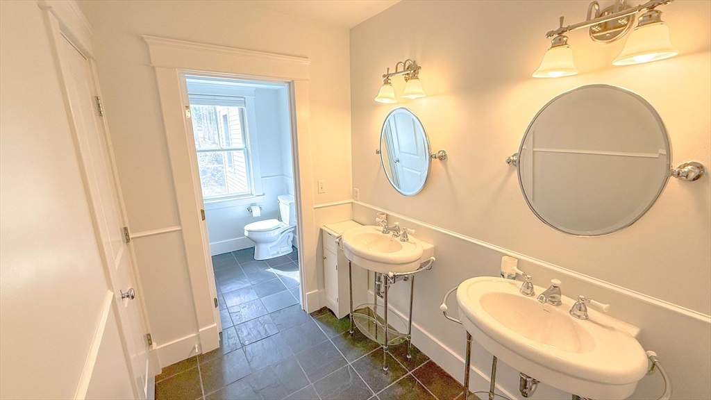 5 Walnut Street Lexington, MA 02421 - Photo 13 of 34 a bathroom with a sink and a mirror
