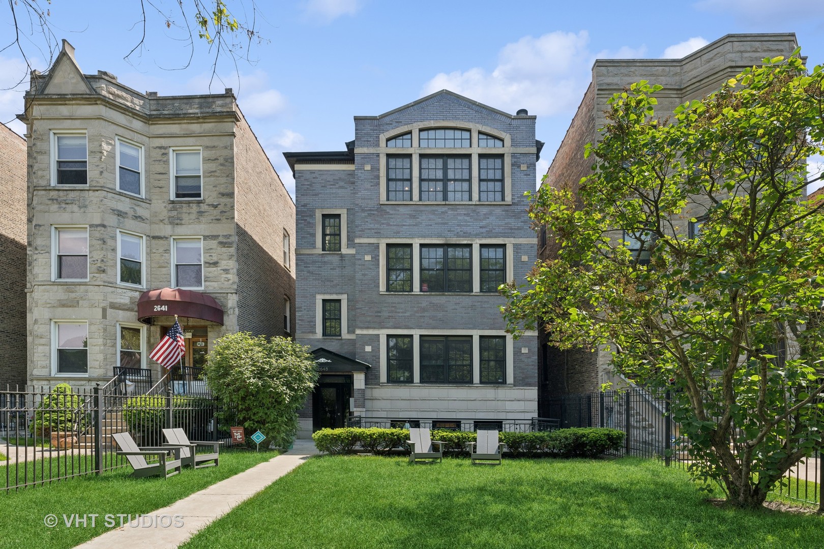 2643 West Logan Boulevard, Unit 3 Chicago, IL 60647 - Photo 1 of 26 a front view of a house with a yard