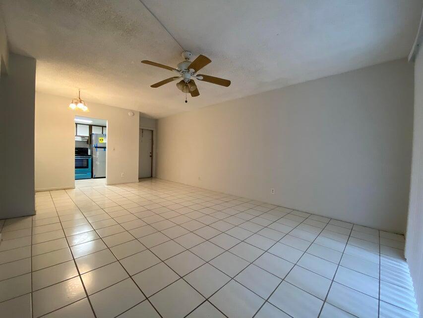 626 Northwest 13th Street, Unit 16 Boca Raton, FL 33486 - Photo 4 of 10 a view of an empty room and window
