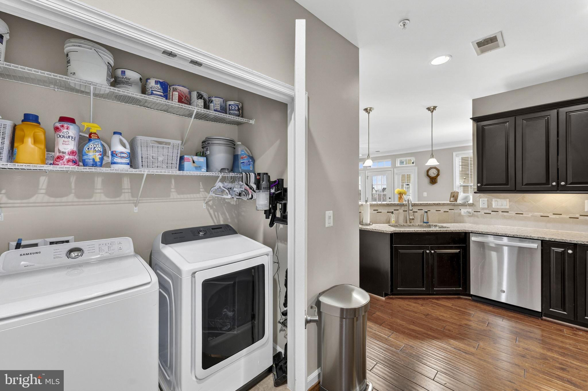 42558 Sunset Ridge Square Ashburn, VA 20148 - Photo 29 of 51 a kitchen with a sink and a stove top oven