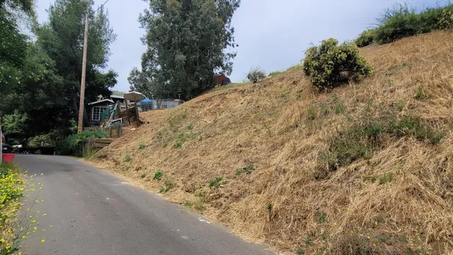 a view of a road with a building in the background