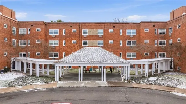 a front view of a building with glass windows