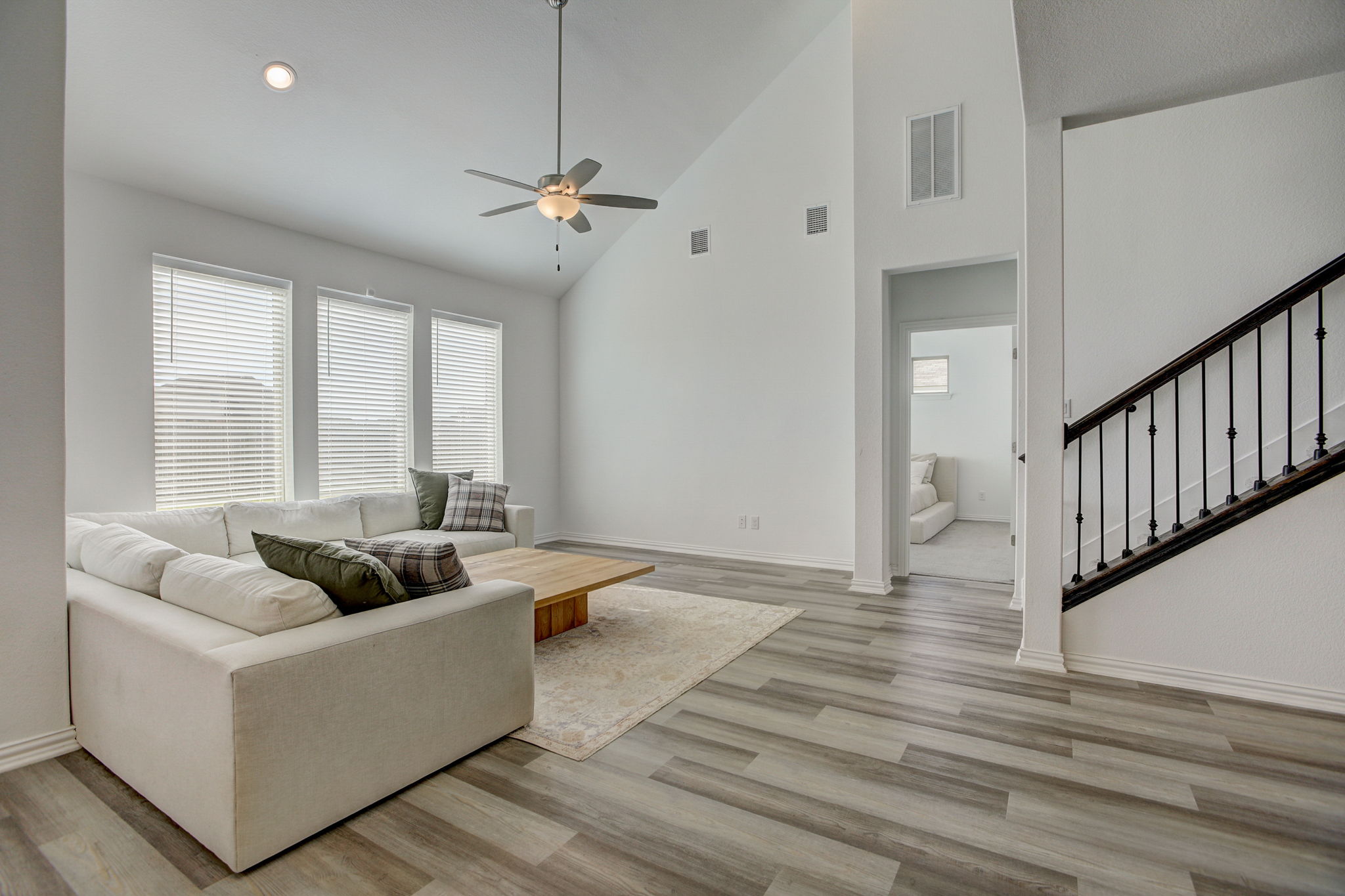 308 Monteforte Road Hutto, TX 78634 - Photo 3 of 32 a living room with furniture and two windows