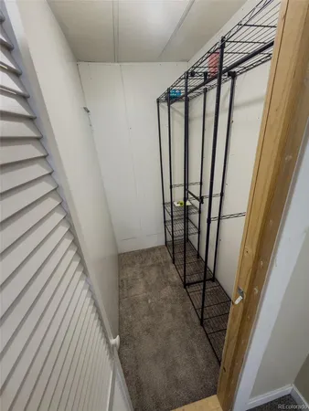 a bedroom with bed and window