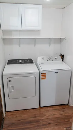 a bathroom with a sink toilet a mirror and shower