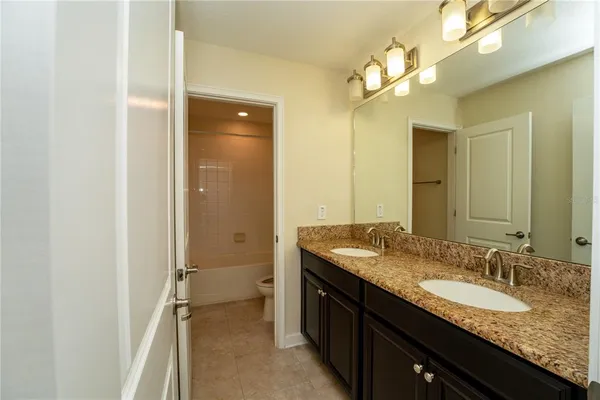 a bathroom with a tub and a sink
