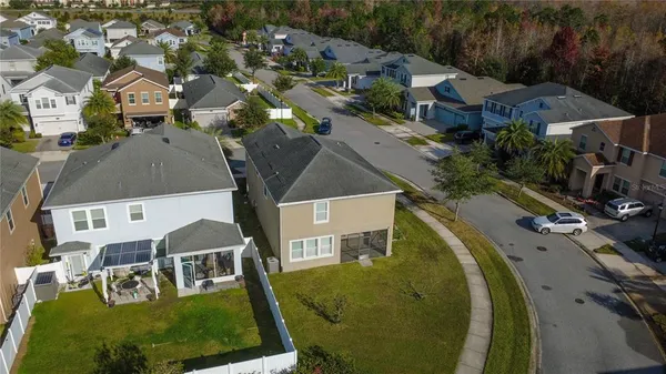 an aerial view of a house with swimming pool