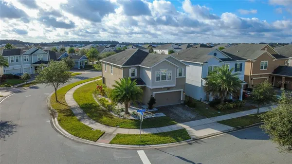 an aerial view of a house with a garden and plants