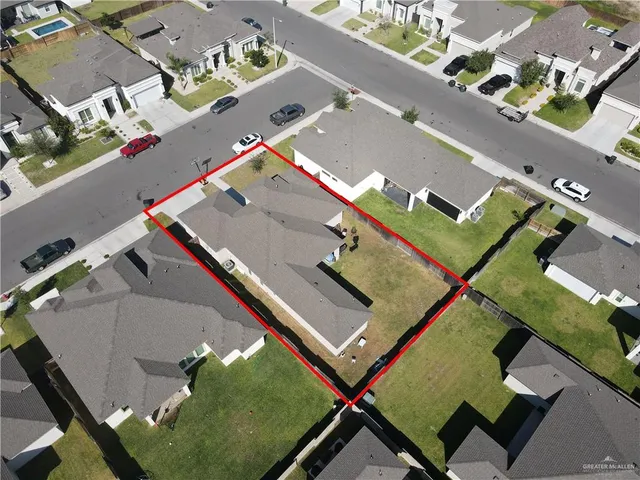 an aerial view of a pool table and chairs in the balcony