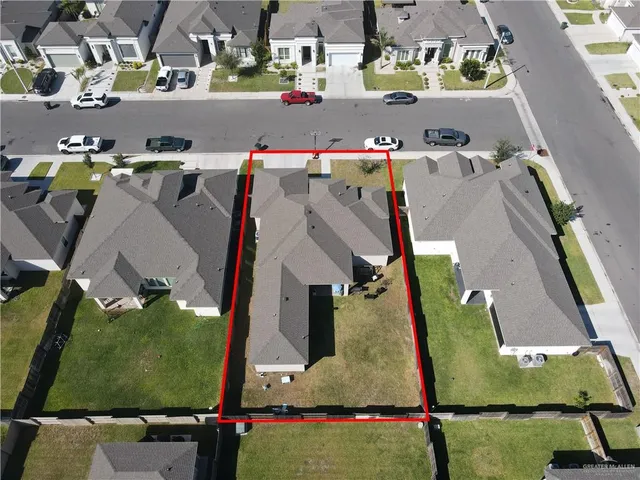 an aerial view of houses with outdoor space