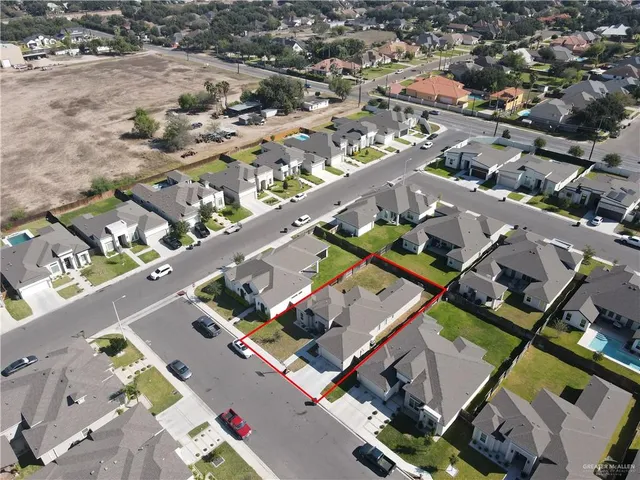 an aerial view of a city with streets and houses